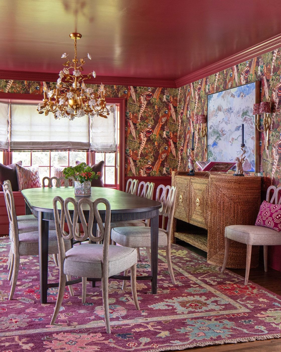Dining room with deep red ceiling and wallcovering