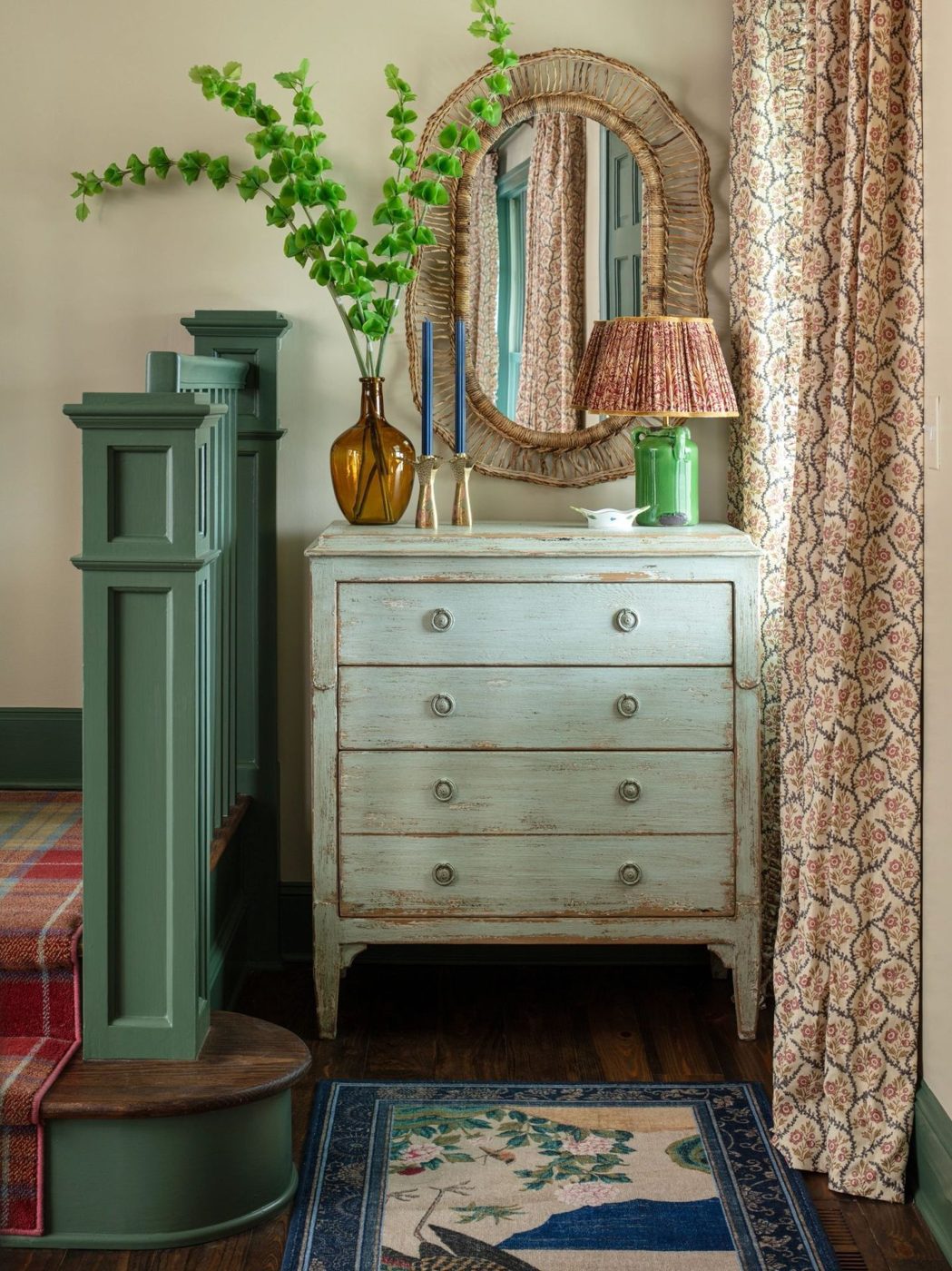 Entry vestibule with painted dresser and green trim