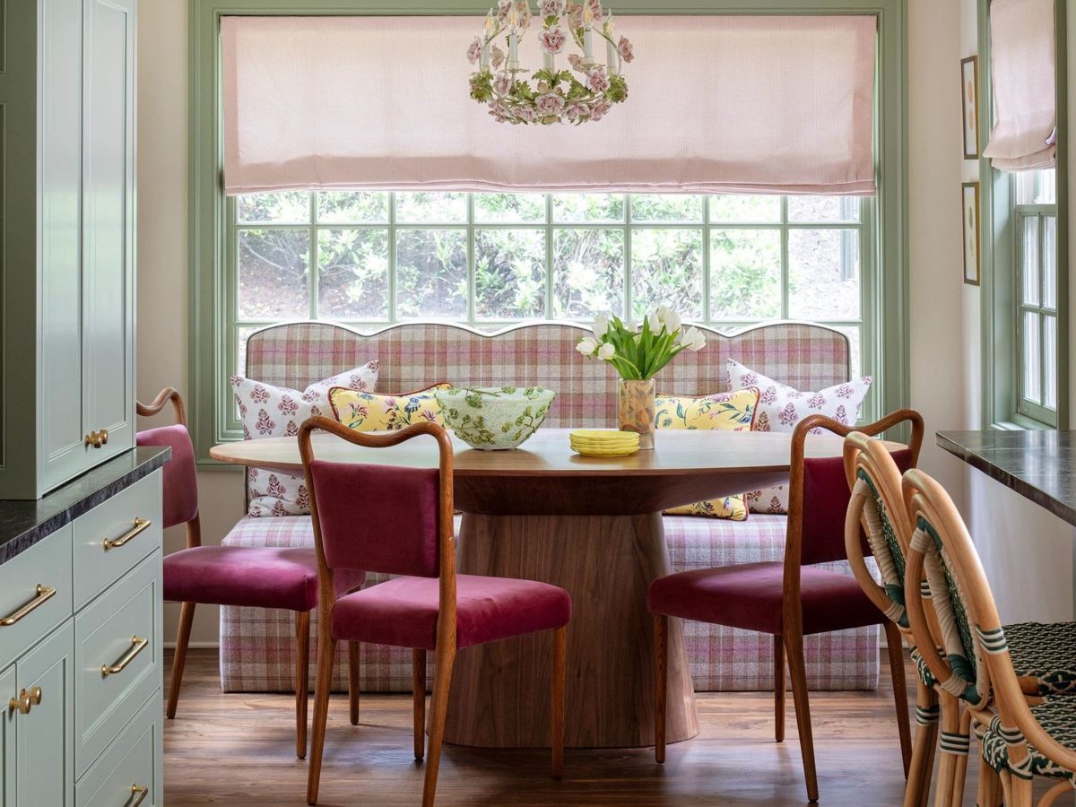 Painted dining room with green trim and built-in cabinetry