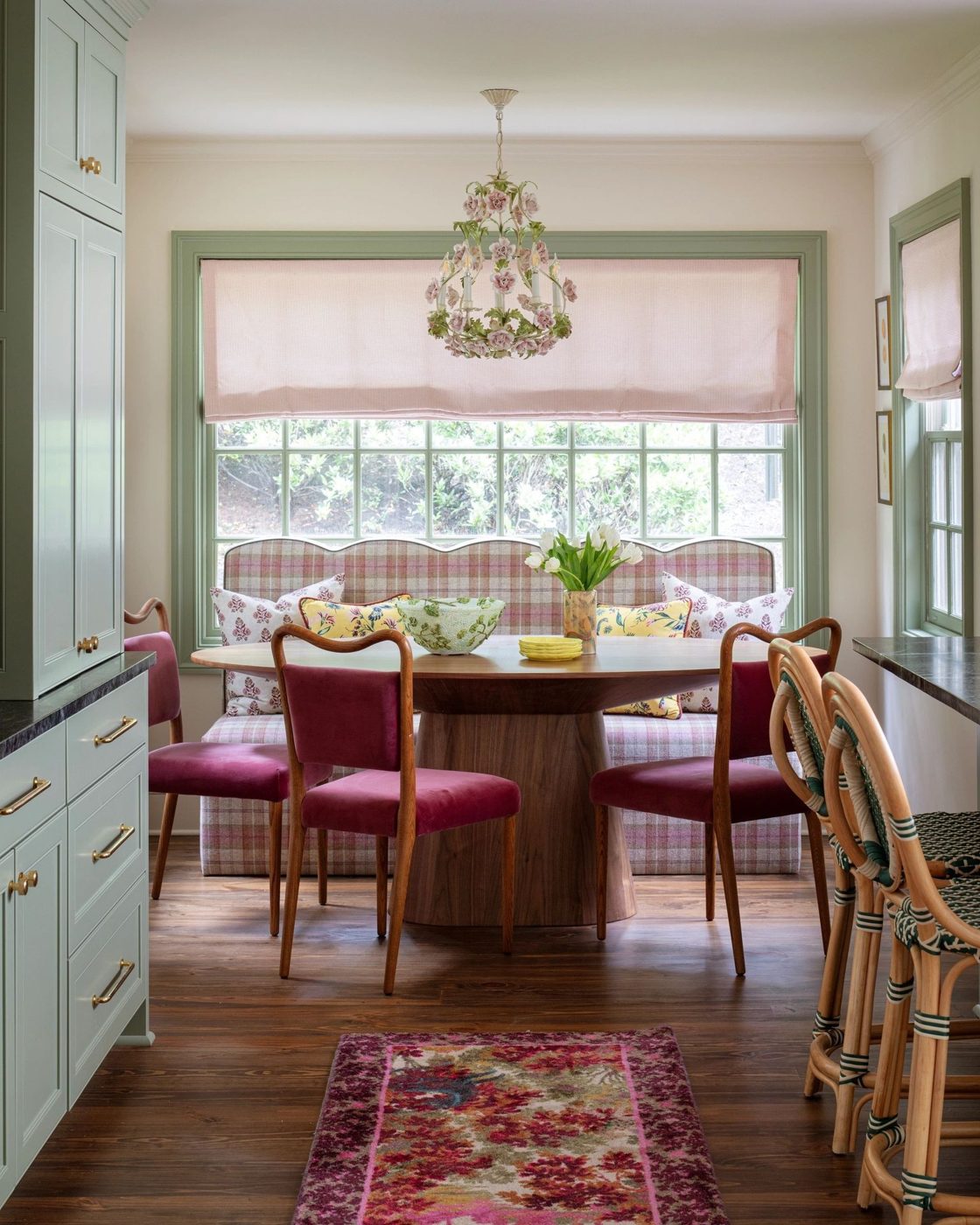 Dining room with green trim and built-in cabinetry